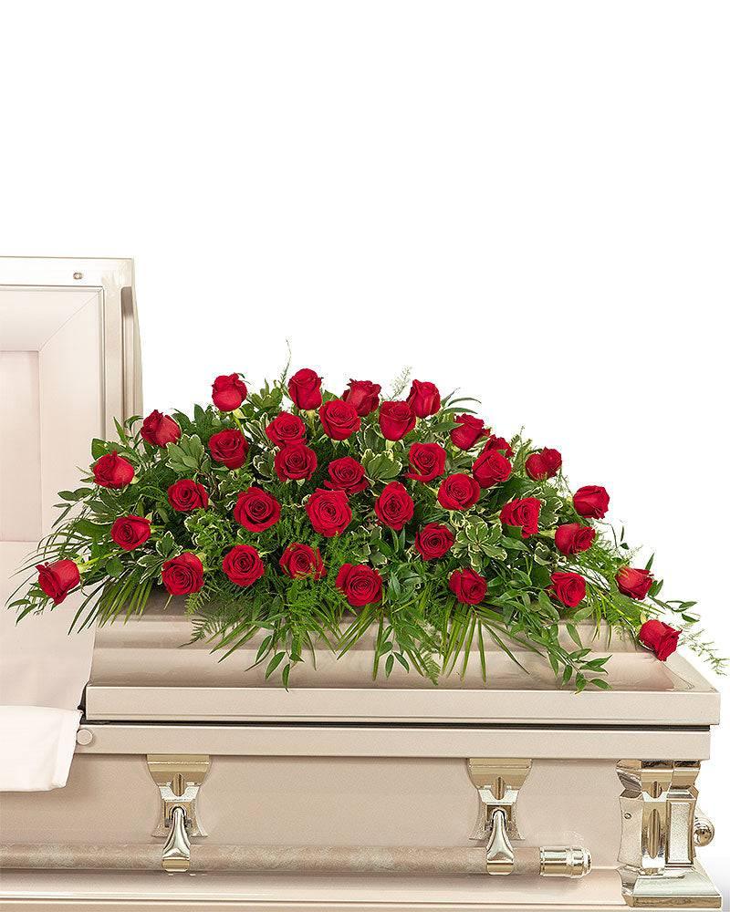 red rose tribute casket spray The Floratory